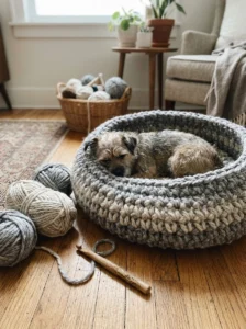 Handmade crochet dog bed with chunky washable yarn and a comfortable textured surface.